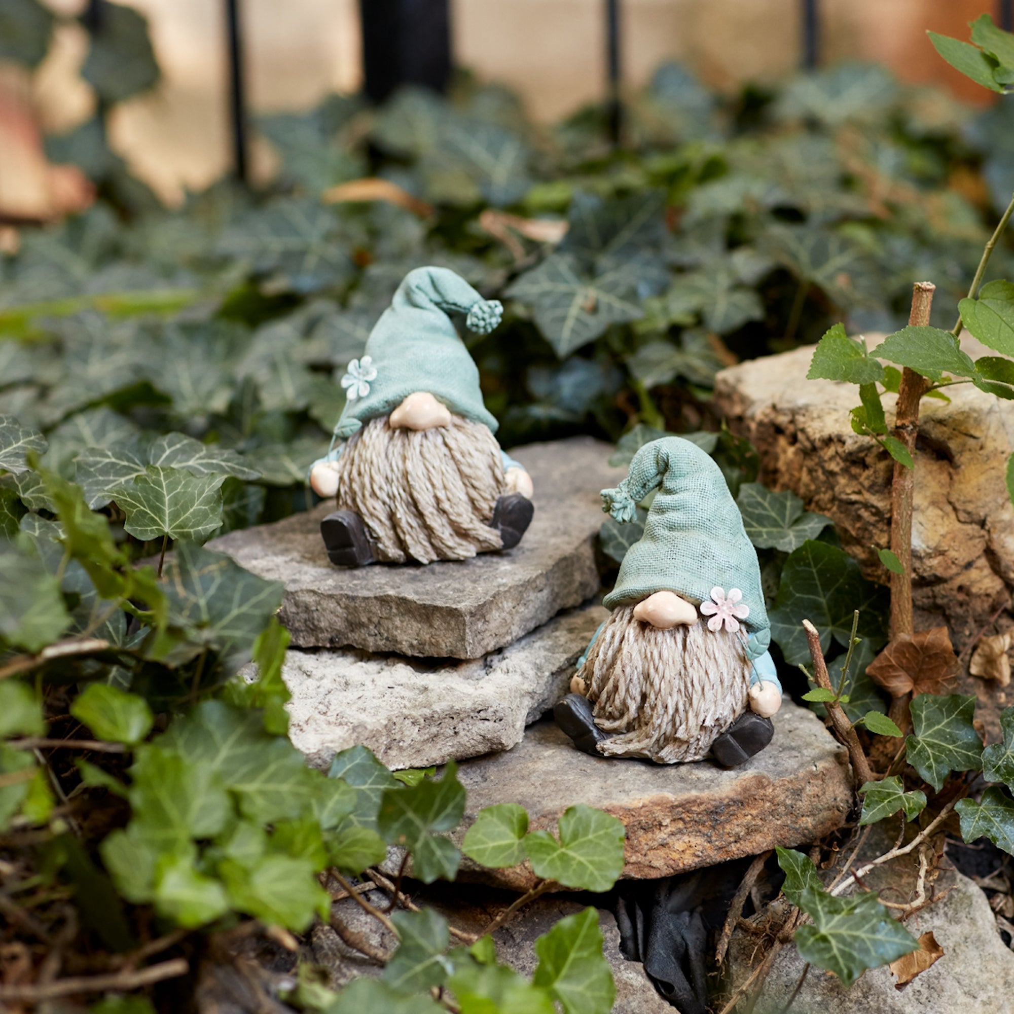Stone Garden Gnome Figurine with Flower Stem Accent (Set of 4)