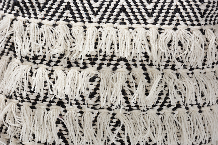 Baxton Studio Alain Moroccan Inspired Black and Ivory Handwoven Wool Tassel Pouf Ottoman