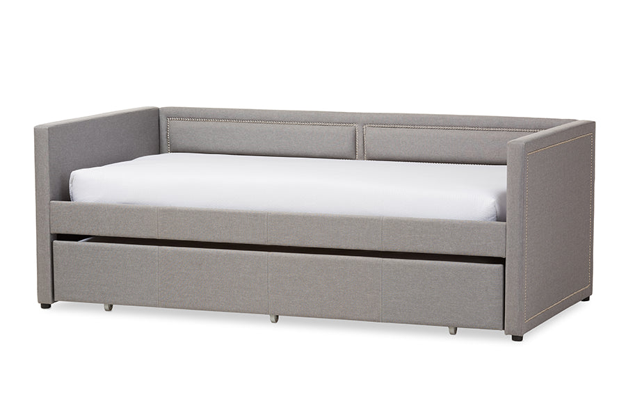 Baxton Studio Raymond Modern and Contemporary Grey Fabric Nail Heads Trimmed Sofa Twin Daybed with Roll-Out Trundle Guest Bed
