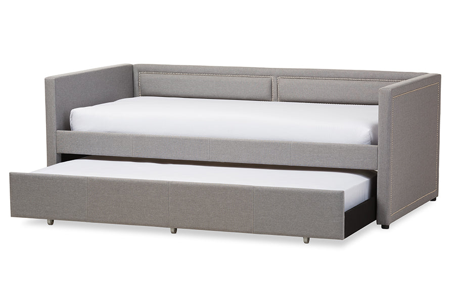 Baxton Studio Raymond Modern and Contemporary Grey Fabric Nail Heads Trimmed Sofa Twin Daybed with Roll-Out Trundle Guest Bed