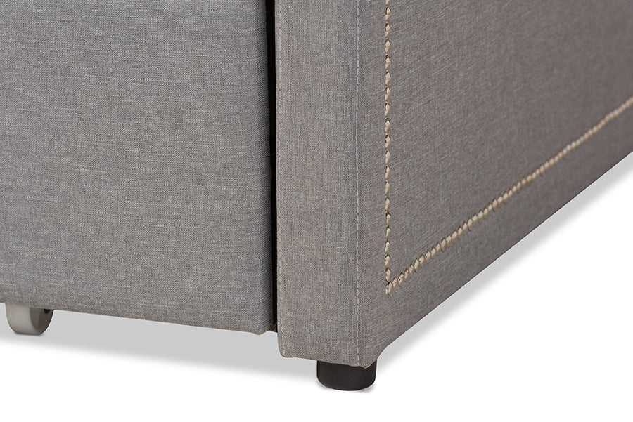 Baxton Studio Raymond Modern and Contemporary Grey Fabric Nail Heads Trimmed Sofa Twin Daybed with Roll-Out Trundle Guest Bed