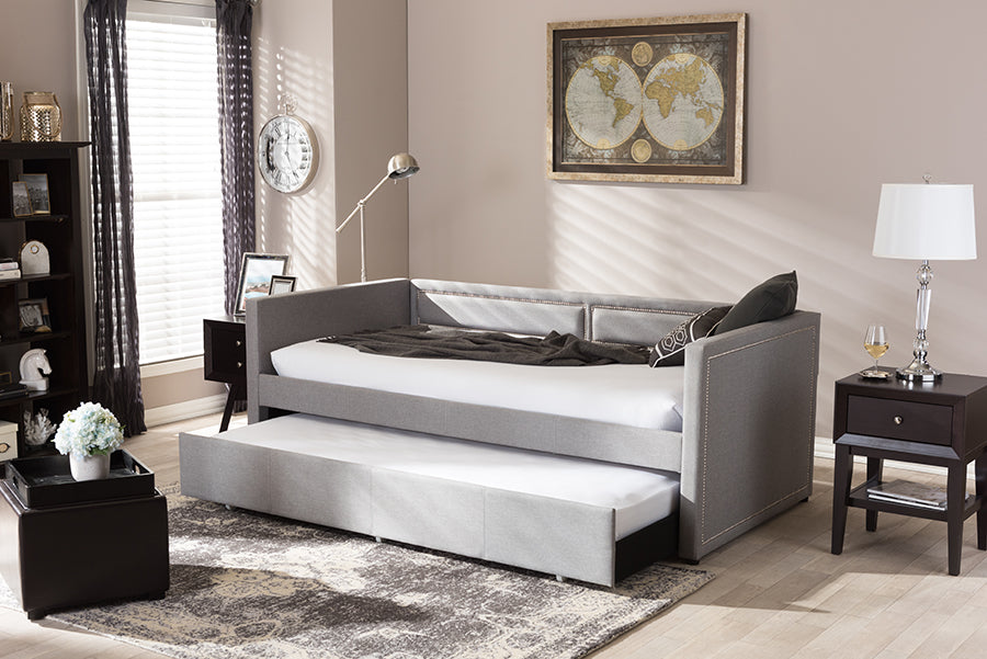 Baxton Studio Raymond Modern and Contemporary Grey Fabric Nail Heads Trimmed Sofa Twin Daybed with Roll-Out Trundle Guest Bed
