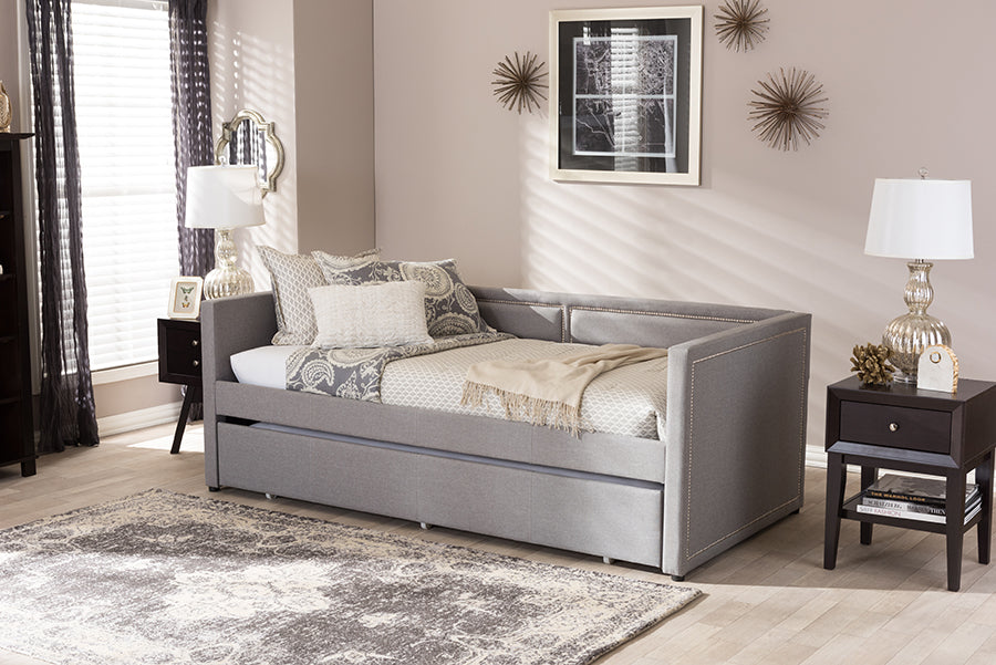 Baxton Studio Raymond Modern and Contemporary Grey Fabric Nail Heads Trimmed Sofa Twin Daybed with Roll-Out Trundle Guest Bed