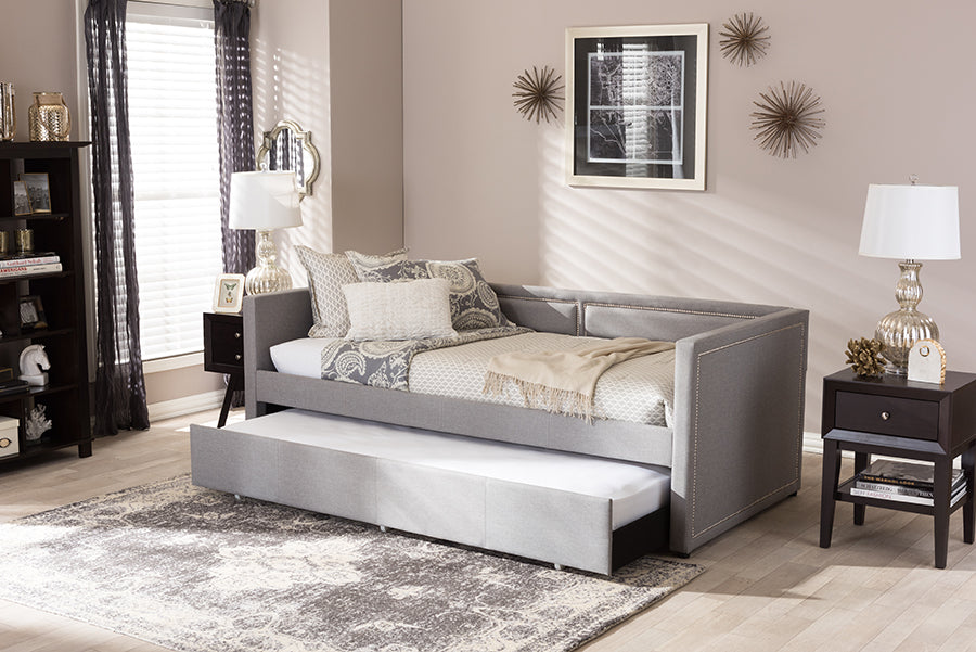 Baxton Studio Raymond Modern and Contemporary Grey Fabric Nail Heads Trimmed Sofa Twin Daybed with Roll-Out Trundle Guest Bed