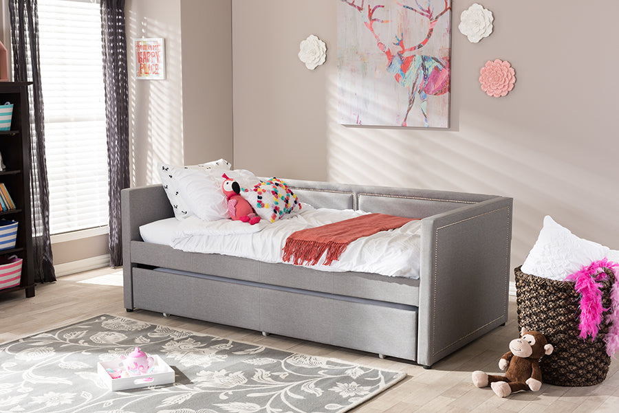 Baxton Studio Raymond Modern and Contemporary Grey Fabric Nail Heads Trimmed Sofa Twin Daybed with Roll-Out Trundle Guest Bed
